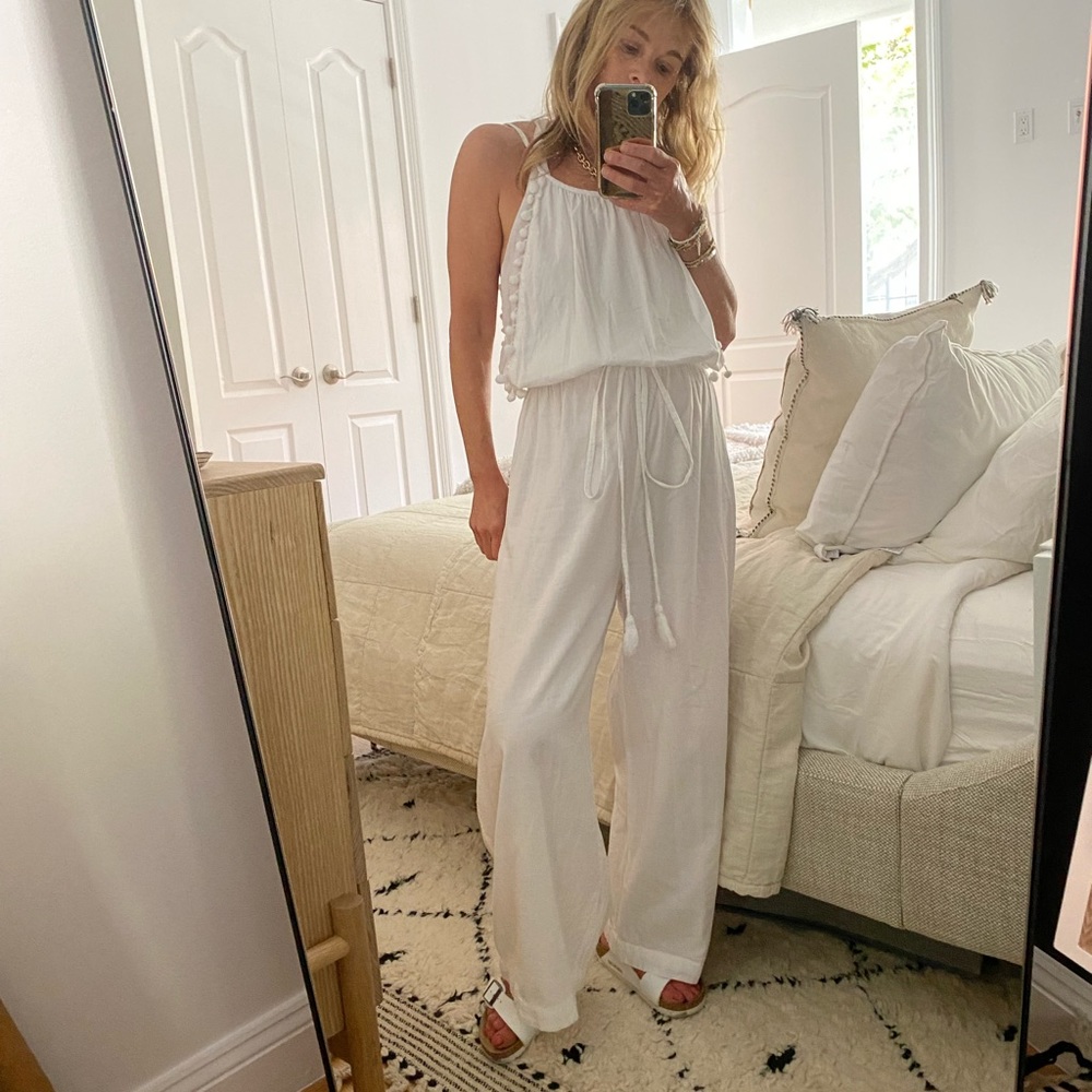 Island tribe white jumpsuit.